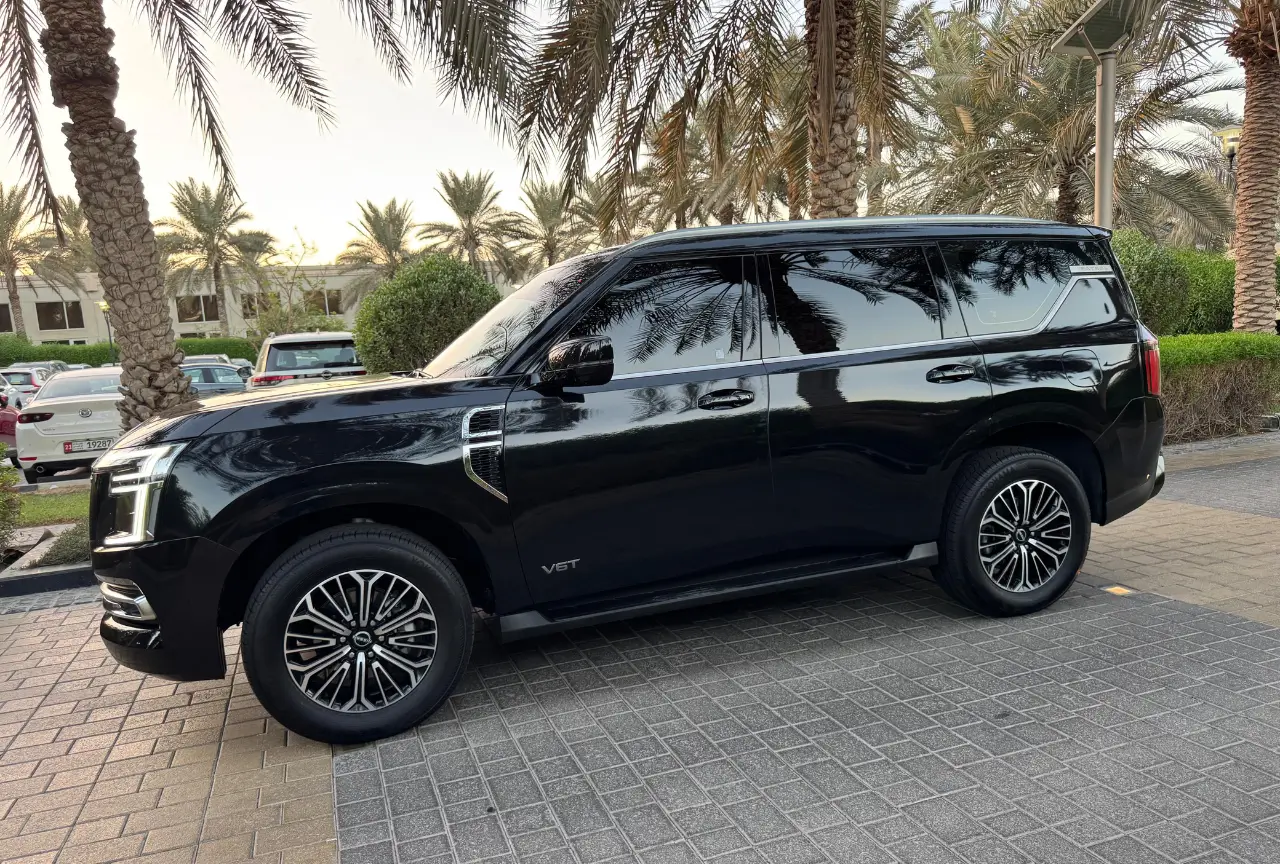 Black Nissan Patrol Twin Turbo side profile in Dubai
